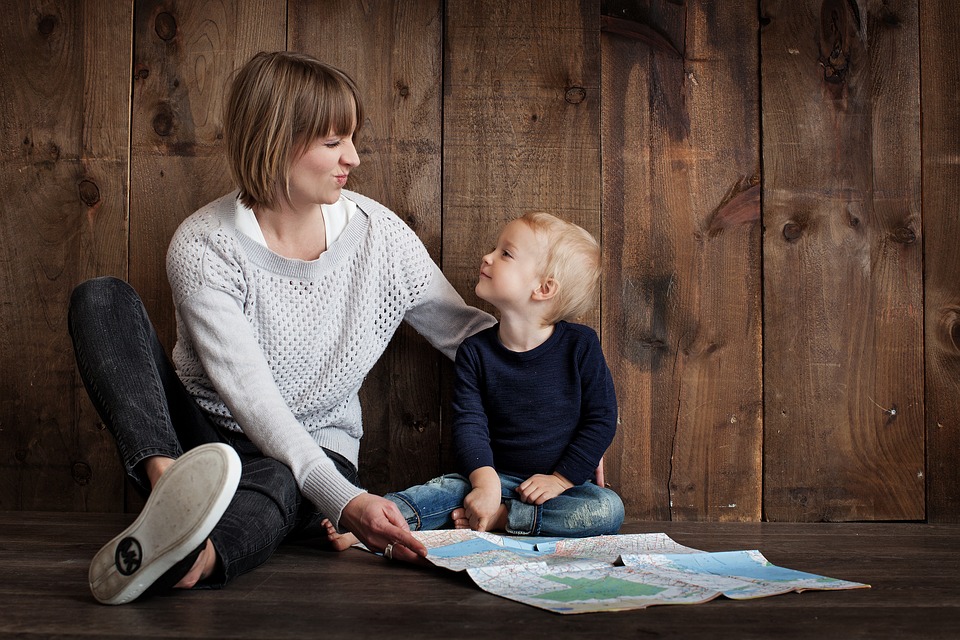 parent child hanging out on the floor - Keeping Costs Under Control Through Divorce - Custody Issue